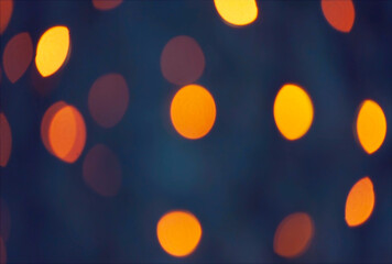 Defocused blurred festive bokeh lights. Blurred garland on Christmas tree as background