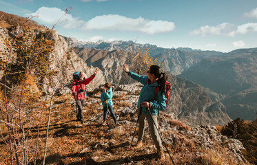 Fototapeta premium Family hiking in mountains, having fun in nature.