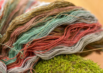 colored wool yarn skeins on a fuzzy background, handicraft concept, hand knitting, autumn time,...