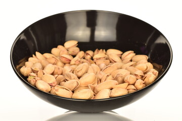 Delicious pistachios, close-up, on a white background.