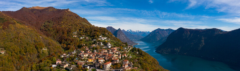 Fototapeta na wymiar Aerial view of Lugano lake and the Monte Brè village in Canton Ticino
