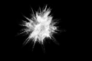 White powder explosion isolated on black background.