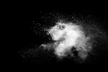 White powder explosion isolated on black background.