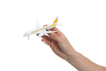 hand holding airplane toy model isolated on white background.