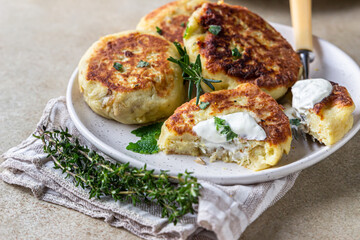 Delicious vegetable cutlets with potato and mushroom served with aromatic herbs and sauce. Healthy diet food concept. Vegan food.