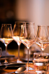 Vertical frame with a warm cozy atmosphere and a festive table with glasses for different types of wine