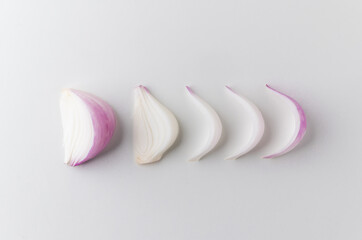 Red onion Sliced in different ways and arranging from small to mature. Top view Garnish and food ingredients on isolated white background.