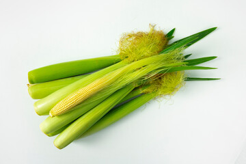 A whole bunch, baby corn, white background