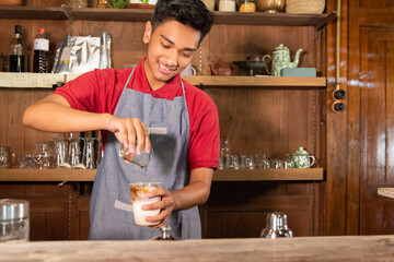 portrait young man make the drink milk coffee