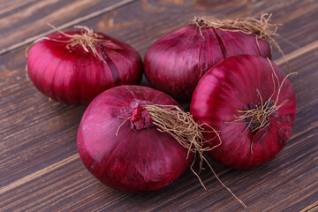 red onions on rustic wood