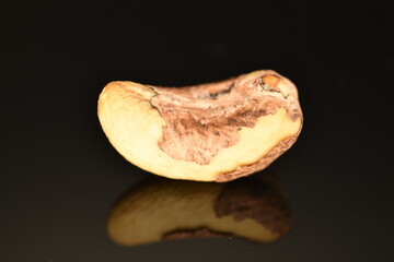 Fragrant roasted cashews, close-up, on a black background.