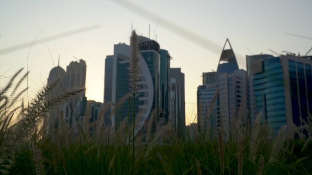 Doha, Qatar- 03 November 2020 :The skyline of Qatar city during sunset with gloomy sky . moving shot