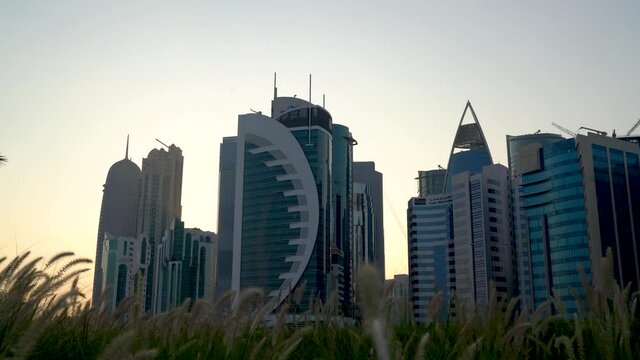 Doha, Qatar- 03 November 2020 :The skyline of Qatar city during sunset with gloomy sky . moving shot