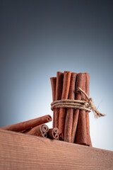 Group cinnamon sticks on wooden