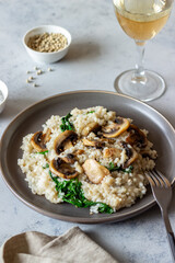 Risotto with mushrooms and spinach. Healthy food. Vegetarian food.