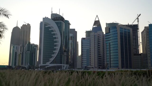 Doha, Qatar- 03 November 2020 :The skyline of Qatar city during sunset with gloomy sky . moving shot