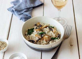 Risotto with mushrooms and spinach. Healthy food. Vegetarian food.