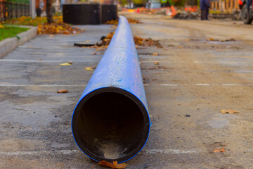 large diameter plastic pipe lies on the street