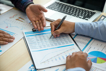 Two young businessmen using touchpad at meeting, People Meeting Design Ideas Concept. business planning.
