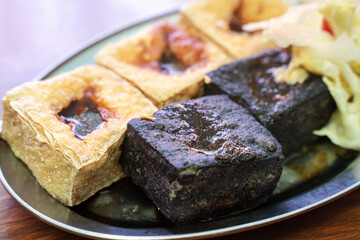 Deep fried stinky tofu with pickled cabbage, famous and delicious street food in Taiwan.