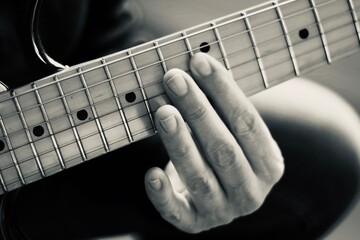 person playing the electric guitar