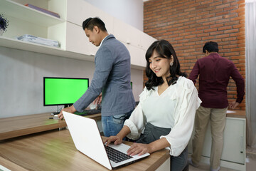 Portrait of coworkers who are busy working according to their respective places. in the office