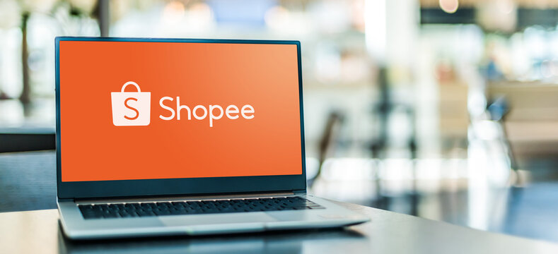 Laptop computer displaying logo of Shopee