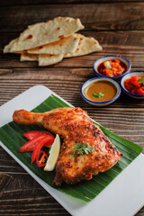 Tandoori Chicken. Indian barbecue chicken. Indian chicken dish prepared by roasting chicken marinated in yogurt and spices