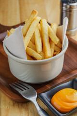 Belgian fries. Belgium traditional food. French fries with cheese dips on the table. Fast food