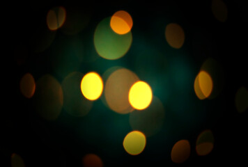 Defocused blurred festive bokeh lights. Blurred garland on Christmas tree as background