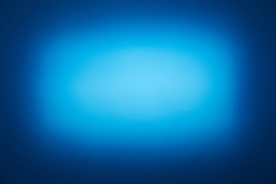 On A Dark Blue Background, A Blurred Rectangular Light Blue Cloud Of Light