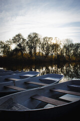 Fototapeta na wymiar Autumn landscape with boats on the pond