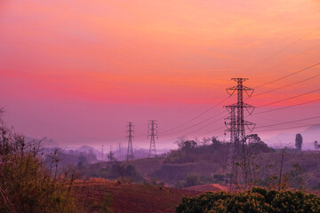Electricity poles  and landscape in the evening at sunset