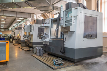 a number of CNC machines in the production room. Interior of industrial premises