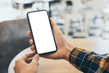 cell phone blank white screen mockup.woman hand holding texting using mobile on desk at office.background empty space for advertise.work people contact marketing business,technology