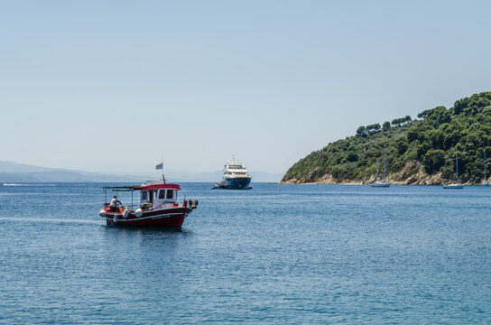 Lihada island, Greece - June 28. 2020: A boat on the sea near the island of Lihada, Greece  