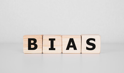 Bias - word from wooden blocks with letters, personal opinions prejudice bias concept, white background