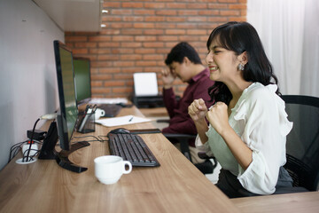 Portrait of frustrated asian female workers. Having hard work in the office