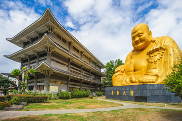 Fototapeta premium Paochueh Temple and Maitreya Statue in taichung, taiwan. Translation: to the satisfaction of all
