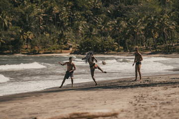 Fototapeta na wymiar Jogabonito - Football soccer playing on the beach