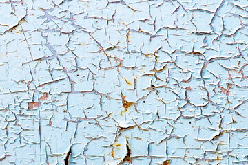 Paint slowly peels off blue wall - paint peels off steel door