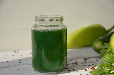 Word detox is made from colored letters. chia seeds. Green smoothies and ingredients. Concept of diet, cleansing the body, healthy eating. lemon green apple, greens, lettuce, vegetables