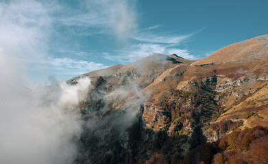Spectacular landscape with white clouds wrap around beautiful mountain Paggaio. Greece