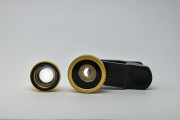 Attaching a lens to your phone's camera: wide-angle and macro photography. External macro lens with...