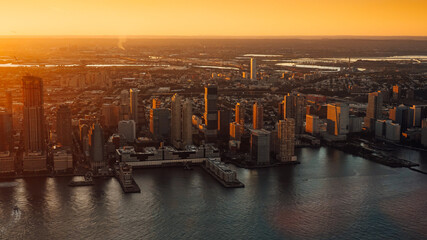 Amazing autumn sunset view from One World Trade Center  sky scraper in New York to South Manhattan with great colors