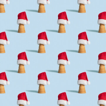 Christmas Seamless Pattern With Ice Cream Con And Santa’s Hat On Light Blue Background