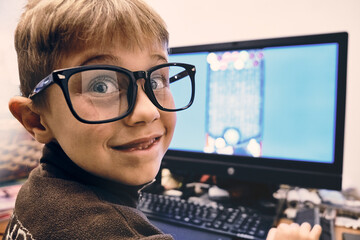 male student at the computer studying with distance learning