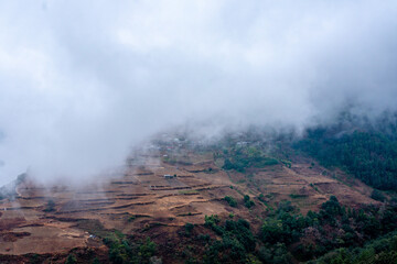 misty fog over village in mountains