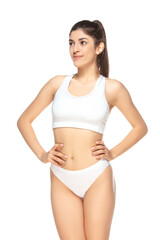 Fototapeta premium Confident. Beautiful female model on white background. Beauty, cosmetics, spa, depilation, diet and treatment, fitness concept. Fit and sportive, sensual body with well-kept skin in underwear.