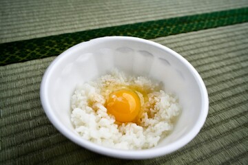 An egg on white rice with soy sauce.